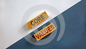 Concept words `core values` on wooden blocks on a beautiful white and blue background. Business concept