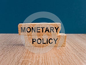 Concept words Monetary Policy on brick blocks. Ideas for Increase or Decrease interest rates, Stimulate the economy, Moneyless