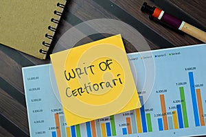 Concept of Writ of Certiorari write on sticky notes isolated on Wooden Table photo