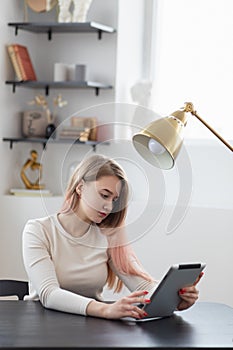 Concept, young woman businesswoman working and online shopping in office on tablet