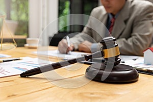 Concepts of law, Lawyer and businessman working and discussing business contract papers in office