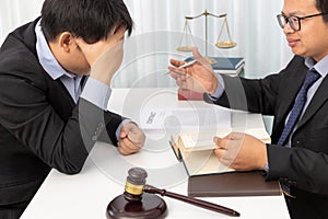 Concepts of law, Lawyer give legal advice to businessman about case in office