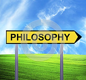 Conceptual arrow sign against beautiful landscape with text - PHILOSOPHY