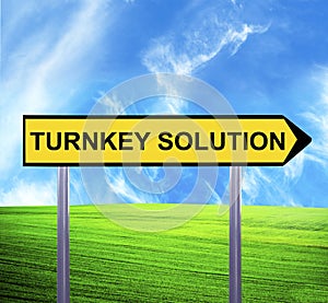 Conceptual arrow sign against beautiful landscape with text - TURNKEY SOLUTION