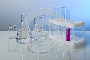 Conceptual background with chemical flasks and lab glassware.