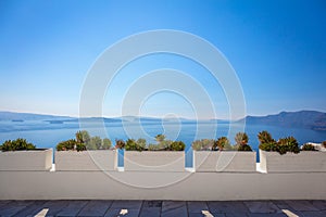Conceptual background - Santorini. Greece, Santorini island, Oia - white architecture, flowers and blue sea and sky. Abstract