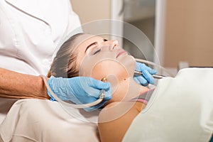 Conceptual beauty and cosmetology image of the hands of several beauticians holding their respective equipment. Beauty