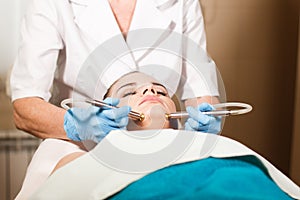 Conceptual beauty and cosmetology image of the hands of several beauticians holding their respective equipment. Beauty