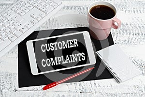 Conceptual caption Customer Complaints. Word Written on expression of dissatisfaction on a consumer s is behalf Wireless