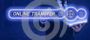 Conceptual caption Online Transfer. Business showcase authorizes a fund transfer over an electronic funds transfer photo