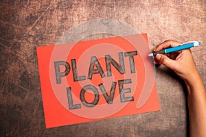 Conceptual caption Plant Love. Business approach a symbol of emotional love, care and support showed to others Writing