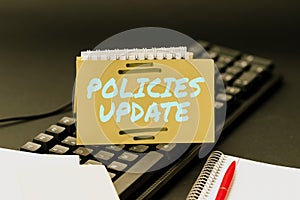 Conceptual caption Policies Update. Business overview act of adding new information or guidelines formulated Typewriting