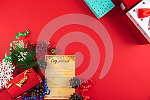 Conceptual christmas background with gift wrappers with ribbons on red, top view and copy space