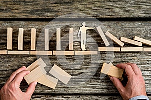 Conceptual close-up of hands building a structure