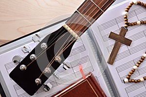 Conceptual detail of Christian religious music with guitar headstock top