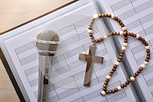 Conceptual detail of Christian religious music with mic top