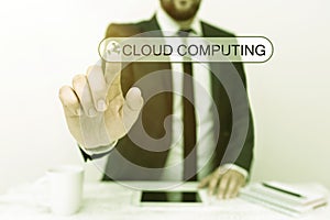 Conceptual display Cloud Computing. Word Written on use a network of remote servers hosted on the Internet Presenting