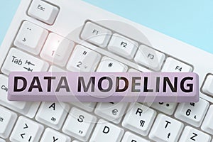 Text caption presenting Data Modeling. Business approach process of transferring data between data storage systems