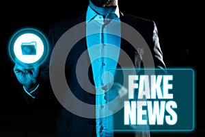 Handwriting text Fake News. Concept meaning Giving information to showing that is not true by the media photo