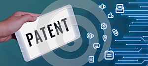 Writing displaying text Patent. Business approach intellectualproperty that gives owner legal right has the sole right photo