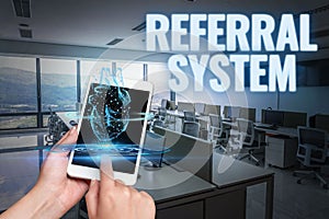 Conceptual display Referral System. Business concept sending own patient to another physician for treatment Hand