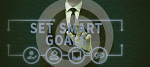 Conceptual display Set Smart Goals. Business approach Establish achievable objectives Make good business plans
