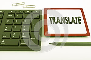 Conceptual display Translate. Word Written on Another word with same equivalent meaning of a target language Computer photo