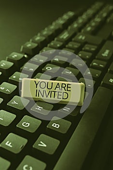 Conceptual display You Are Invited. Internet Concept Receiving and invitation for an event Join us to celebrate