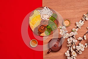 Conceptual flat lay Chinese New Year food and drink still life.