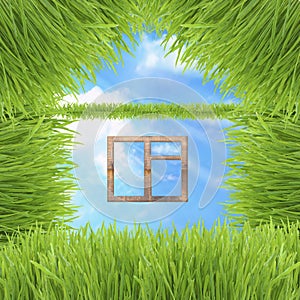 Conceptual green grass house on sky background