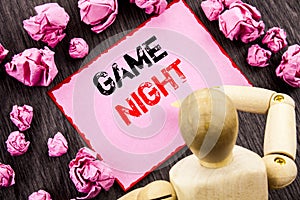 Conceptual hand text showing Game Night. Concept meaning Entertainment Fun Play Time Event For Gaming written on Sticky Note Holdi