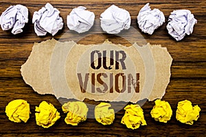 Conceptual hand text word Our Vision. Business concept for Marketing Strategy Vision Written on sticky note, wooden with sticky, m