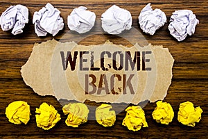 Conceptual hand text word Welcome Back. Business concept for Emotion Greeting Written on sticky note, wooden with sticky, many fol