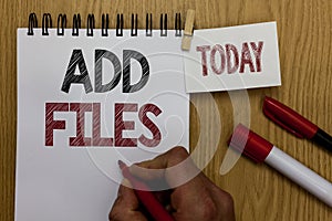 Conceptual hand writing showing Add Files. Business photo text To put more information to a certain person,thing,or document Man h