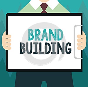 Conceptual hand writing showing Brand Building. Business photo showcasing Generating awareness Establishing and promoting company