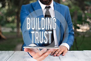 Conceptual hand writing showing Building Trust. Business photo showcasing activity of emerging trust between showing to work