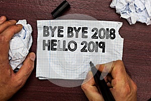 Conceptual hand writing showing Bye Bye 2018 Hello 2019. Business photo text Starting new year Motivational message 2018 is over H