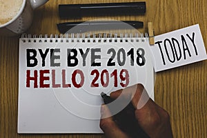 Conceptual hand writing showing Bye Bye 2018 Hello 2019. Business photo text Starting new year Motivational message 2018 is over W