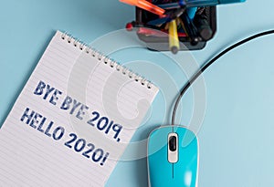 Conceptual hand writing showing Bye Bye 2019 Hello 2020. Business photo showcasing saying goodbye to last year and