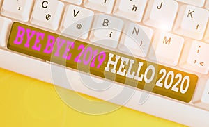 Conceptual hand writing showing Bye Bye 2019 Hello 2020. Business photo showcasing saying goodbye to last year and welcoming