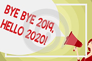 Conceptual hand writing showing Bye Bye 2019 Hello 2020. Business photo text saying goodbye to last year and welcoming