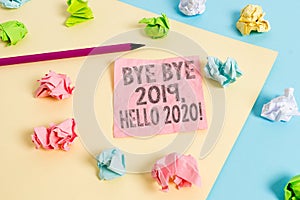 Conceptual hand writing showing Bye Bye 2019 Hello 2020. Business photo text saying goodbye to last year and welcoming