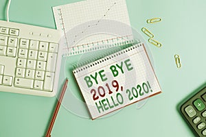 Conceptual hand writing showing Bye Bye 2019 Hello 2020. Business photo text saying goodbye to last year and welcoming