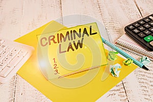 Conceptual hand writing showing Criminal Law. Business photo text legal system which relates to punishing those commits