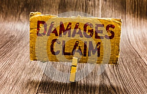 Conceptual hand writing showing Damages Claim. Business photo text Demand Compensation Litigate Insurance File Suit