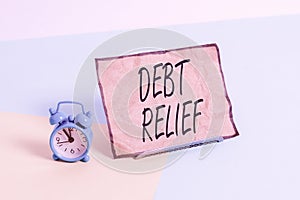 Conceptual hand writing showing Debt Relief. Business photo text a reduction in the amount of debt that a country has to pay Alarm