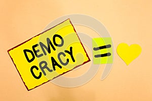 Conceptual hand writing showing Demo Cracy. Business photo text freedom of the people to express their feelings and beliefs Yellow