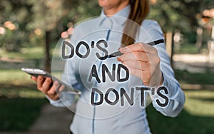 Conceptual hand writing showing Do S Is And Dont S Is. Business photo text advising Rules or customs concerning some