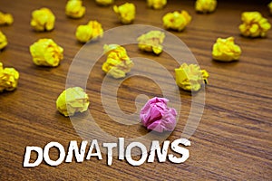 Conceptual hand writing showing Donations. Business photo showcasing something that is given to charity especially sum