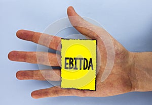 Conceptual hand writing showing Ebitda. Business photo showcasing Earnings before tax is measured to evaluate company performance